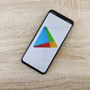 smart phone with a logo on a wooden table