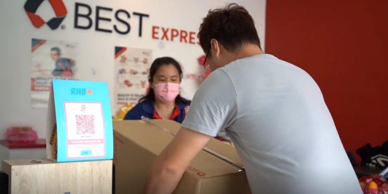 BEST Express Malaysia counter service - customer dropping off parcel at service point