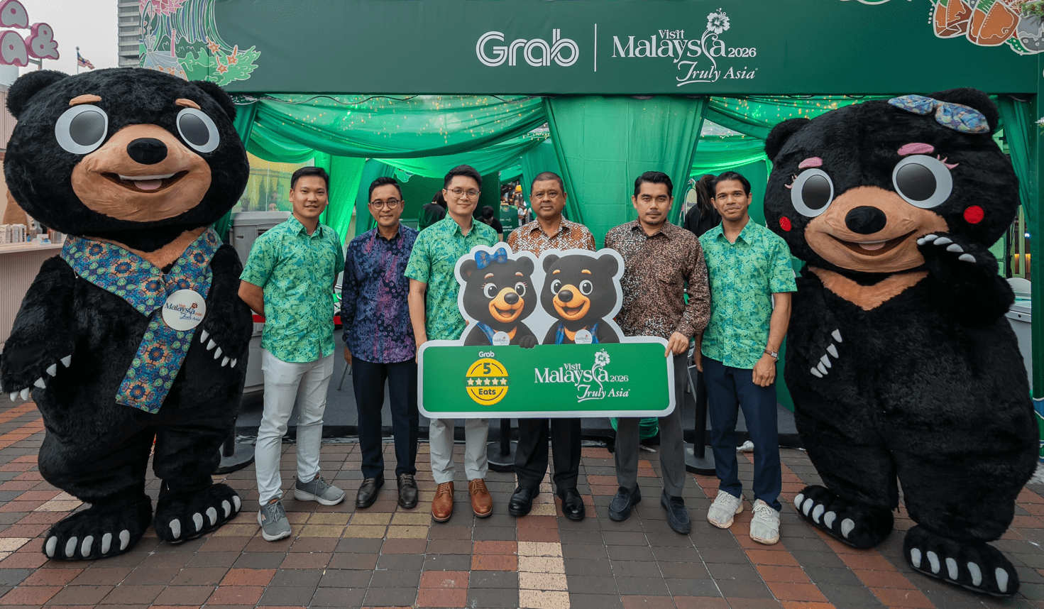 Grab Malaysia × Visit Malaysia 2026 5-Star Eats mural launch event with bear mascots and Tourism Malaysia officials