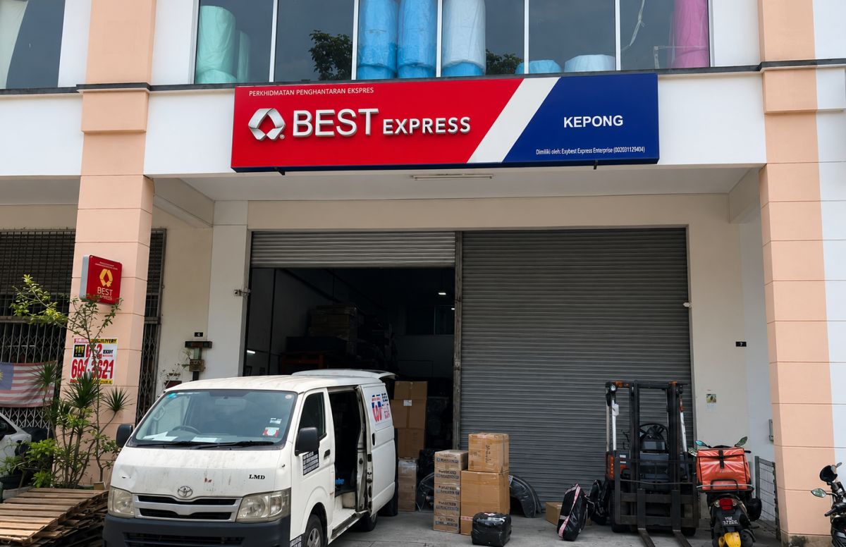 BEST Express Kepong station exterior with company signage, delivery van and packages at the loading bay