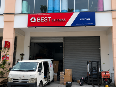 BEST Express Kepong station exterior with company signage, delivery van and packages at the loading bay