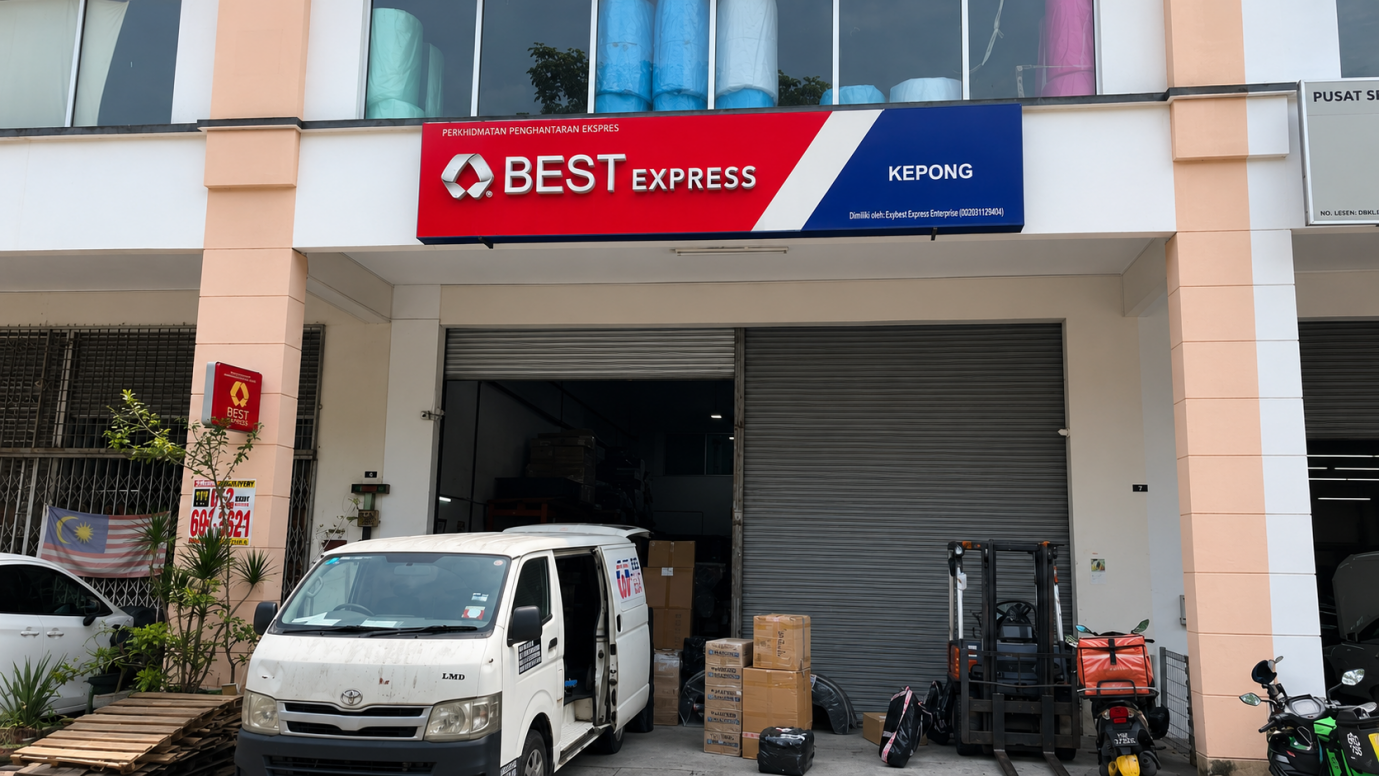 BEST Express Kepong station exterior with company signage, delivery van and packages at the loading bay